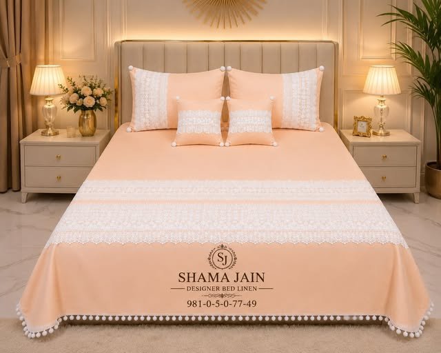 Peach bedlinen with white lace and pom-pom detailing from Shama Jain